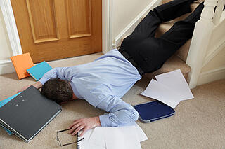 Business man falling down the steps and dropping important papers