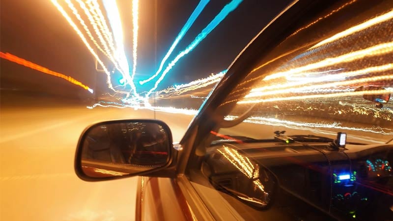 View from the driver window of a car with abstract lights.