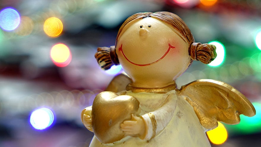 Christmas tree decoration of a little angel smiling.