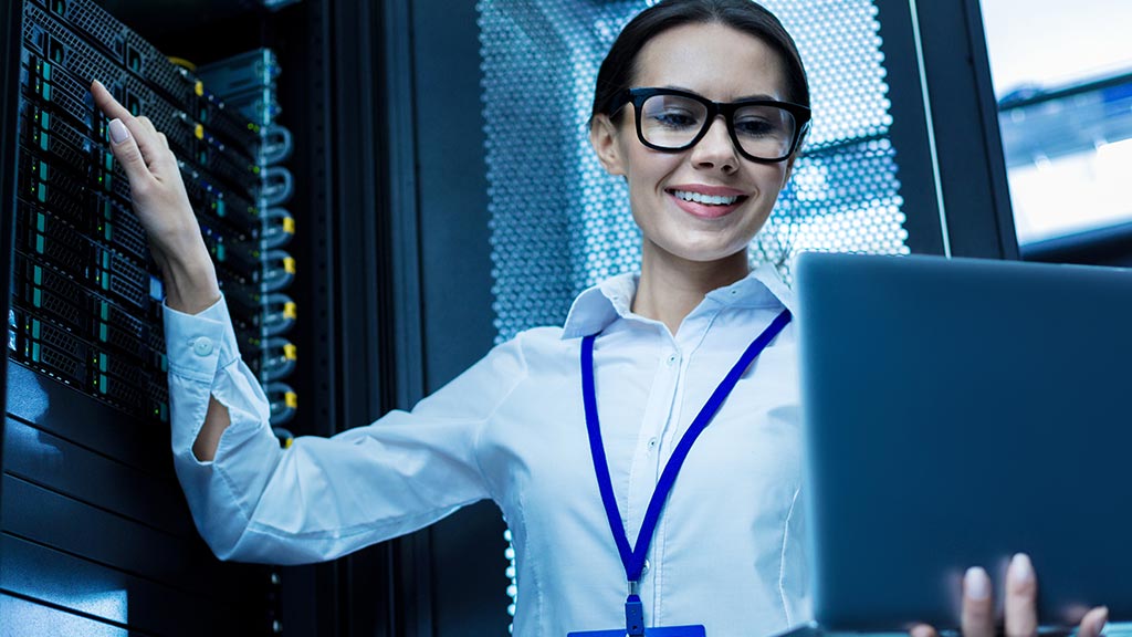 woman-working-on-server-holding-laptop