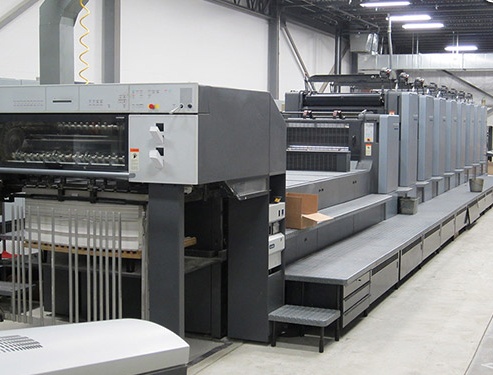 Printing press inside of a package printing facility